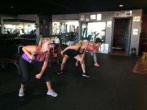 Physiques Gym clients working to build better bodies