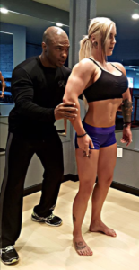 Physiques Gym celebrity personal trainer and posing coach with athlete